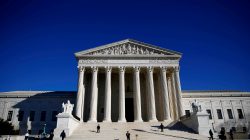 FILE PHOTO: Police officers stand in front of the U.S. Supreme Court in Washington, DC, U.S., January 19, 2018. REUTERS/Eric Thayer/File Photo