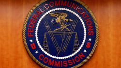 FILE PHOTO: The Federal Communications Commission (FCC) logo is seen before the FCC Net Neutrality hearing in Washington, U.S., February 26, 2015. REUTERS/Yuri Gripas/File Photo