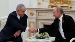 FILE PHOTO: Russian President Vladimir Putin and Israeli Prime Minister Benjamin Netanyahu shake hands during a meeting at the Kremlin in Moscow, Russia May 9, 2018. Sergei Ilnitsky/Pool/File Photo via REUTERS