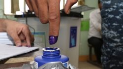 An Iraqi security member dips his finger in ink after casting his vote at a polling station, two days before polls open to the public in a parliamentary election in Kirkuk, Iraq May 10, 2018. REUTERS/Ako Rasheed