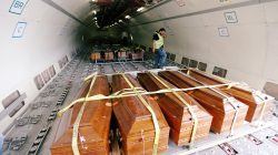 Coffins containing the remains of the bodies of Egyptian Copts killed by Islamic State militants in Sirte are carried by the plane to be transferred to Egypt, in Misrata, Libya May 14, 2018. REUTERS/Ismail Zitouny