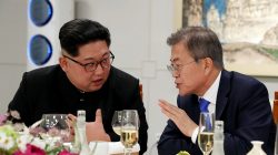 FILE PHOTO - South Korean President Moon Jae-in and North Korean leader Kim Jong Un attend a banquet on the Peace House at the truce village of Panmunjom inside the demilitarized zone separating the two Koreas, South Korea, April 27, 2018. Korea Summit Press Pool/Pool via Reuters