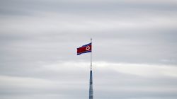 FILE PHOTO: A North Korean flag flutters on top of a 160-metre tower in North Korea's propaganda village of Gijungdong, in this picture taken from the Tae Sung freedom village near the Military Demarcation Line (MDL), inside the demilitarised zone separating the two Koreas, in Paju, South Korea, April 24, 2018. REUTERS/Kim Hong-Ji