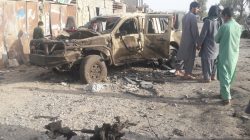 Residents look at an Army vehicle which was damaged during battle between Afghan security forces and Taliban in Farah province, Afghanistan May 16, 2018. REUTERS/Stringer