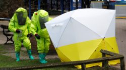 FILE PHOTO: The forensic tent, covering the bench where Sergei Skripal and his daughter Yulia were found, is repositioned by officials in protective suits in the centre of Salisbury, Britain, March 8, 2018. REUTERS/Peter Nicholls/File Photo