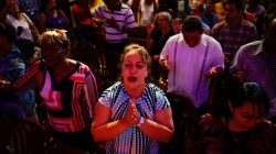 People react during a religious ceremony where victims of the Boeing 737 plane crash were remembered at a church in Havana, Cuba, May 20, 2018. REUTERS/Alexandre Meneghini