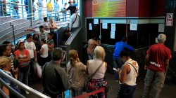 People wait in line to buy bus tickets at a bus station in Caracas, Venezuela May 21, 2018. REUTERS/Marco Bello