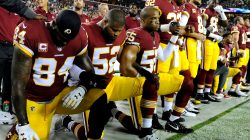 FILE PHOTO: Washington Redskins tight end Niles Paul (84) and linebacker Ryan Anderson (52) and Washington Redskins linebacker Chris Carter (55) kneel with teammates during the playing of the national anthem before the game between the Washington Redskins and the Oakland Raiders at FedEx Field in Landover, MD, U.S., September 24, 2017. Mandatory Credit: Brad Mills-USA TODAY Sports/File Photo