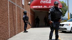 FILE PHOTO: Police officers guard the entrance of the Coca-Cola FEMSA distribution plant after it closes down due to the issues of security and violence during the campaign rally of Independent presidential candidate Margarita Zavala (unseen) in Ciudad Altamirano, Guerrero state, Mexico April 3, 2018. REUTERS/Ginnette Riquelme/File Photo