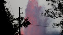 Lava from the Kilauea volcano shoots into the air from a fissure near Luana Street, in the Leilani Estates near Pahoa, Hawaii, U.S., May 29, 2018. REUTERS/Marco Garcia