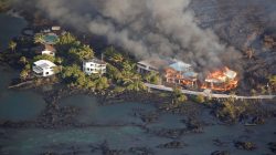 Lava destroys homes in the Kapoho area, east of Pahoa, during ongoing eruptions of the Kilauea Volcano in Hawaii, June 5, 2018. REUTERS/Terray Sylvester