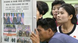 North Koreans watch the displayed local newspapers reporting the summit between the U.S. and North Korea at a subway station in Pyongyang, North Korea, in this photo taken by Kyodo June 13, 2018. Mandatory credit Kyodo/via REUTERS