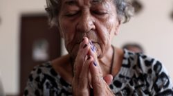 An elderly woman prays at a chapel of the San Rafael nursing home in Arecibo, Puerto Rico February 14, 2018. Picture taken February 14, 2018. REUTERS/Alvin Baez