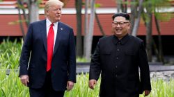 U.S. President Donald Trump and North Korean leader Kim Jong Un walk after lunch at the Capella Hotel on Sentosa island in Singapore June 12, 2018. REUTERS/Jonathan Ernst