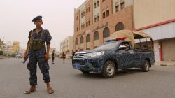 A pro-Houthi police trooper stands past a patrol vehicle in the Red Sea port city of Hodeidah, Yemen June 14, 2018. REUTERS/Abduljabbar Zeyad