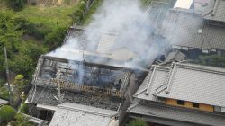 Smoke arise from a house where a fire breaks out, in Takatsuki, Osaka prefecture, western Japan, in this photo taken by Kyodo June 18, 2018. Mandatory credit Kyodo/via REUTERS