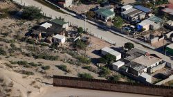 A U.S. border fence between Mexico and the United States ends in the back yard of homes in Juarez, Mexico next to Sunland Park, New Mexico, U.S. June 18, 2018. REUTERS/Mike Blake