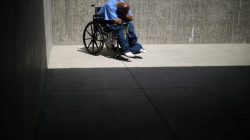 An inmate sits in the yard of a cellblock which mainly houses prisoners with cognitive decline, Alzheimer's, and dementia, at the California Health Care Facility in Stockton, California, U.S., May 24, 2018. REUTERS/Lucy Nicholson