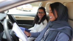 Driving instructor Ahlam al-Somali (R) reads instructions before getting ready to drive with trainee Maria al-Faraj at Saudi Aramco Driving Center in Dhahran, Saudi Arabia, June 6, 2018. REUTERS/Ahmed Jadallah