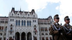 Two soldiers stand in front of the Hungarian Parliament building in Budapest, Hungary, May 29, 2018. REUTERS/Bernadett Szabo