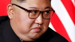 FILE PHOTO: North Korea's leader Kim Jong Un listens to U.S. President Donald Trump as they meet in a one-on-one bilateral session at the start of their summit at the Capella Hotel on the resort island of Sentosa, Singapore June 12, 2018. REUTERS/Jonathan Ernst/File Photo