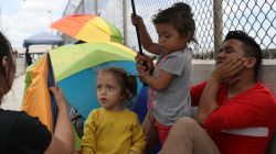 Honduran families seeking asylum wait on the Mexican side of the Brownsville-Matamoros International Bridge after being denied entry by U.S. Customs and Border Protection officers near Brownsville, Texas, U.S., June 24, 2018. REUTERS/Loren Elliott