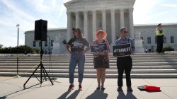 Anti-abortion activists (L-R) Terrisa Bukovinac, Megan Lott and Peter Hinman stand outside of the U.S. Supreme Court in Washington, U.S., June 26, 2018. REUTERS/Leah Millis