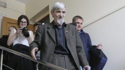 FILE PHOTO: Historian Yuri Dmitriev (C) walks after a hearing inside a court building in Petrozavodsk, Russia April 5, 2018. REUTERS/Vladimir Larionov/File Photo
