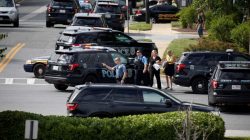 Law enforcement officials survey the scene after a gunman fired through a glass door at the Capital Gazette newspaper and sprayed the newsroom with gunfire, killing at least five people and injuring several others, in Annapolis, Maryland, U.S., June 28, 2018. REUTERS/Joshua Roberts