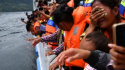 Relatives of missing passengers react during a visit to the location of the ferry that sank at Lake Toba in Simalungun, North Sumatra, Indonesia July 2, 2018. Antara Foto/Sigid Kurniawan/via REUTERS