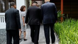 FILE PHOTO: U.S. President Donald Trump and North Korea's leader Kim Jong Un walk together before their working lunch during their summit at the Capella Hotel on the resort island of Sentosa, Singapore June 12, 2018. Picture taken June 12, 2018. REUTERS/Jonathan Ernst