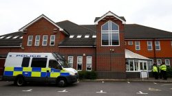Police officers stand in front of Amesbury Baptist Church, which has been cordoned off after two people were hospitalised and police declared a 'major incident', in Amesbury, Wiltshire, Britain, July 4, 2018. REUTERS/Henry Nicholls
