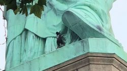 A protester is seen on the Statue of Liberty in New York, New York, U.S., July 4, 2018 in this picture obtained from social media. Danny Owens/via REUTERS