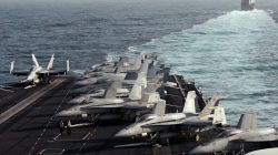 FILE PHOTO: The Sterett Destroyer escorts the Nimitz-class aircraft carrier USS Abraham Lincoln (CVN 72) during a transit through the Strait of Hormuz, February 14, 2012. REUTERS/Jumana El Heloueh/File Photo