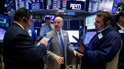 FILE PHOTO: Traders work on the floor of the New York Stock Exchange (NYSE) in New York, U.S., June 28, 2018. REUTERS/Brendan McDermid