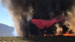 An air tanker drops retardant on wildfire called "BentonFire" near off Benton Road and Crams Corner Drive in this image on social media in Anza in Riverside County, California, U.S., July 4, 2018. Courtesy California Department of Forestry and Fire Protection/Handout via REUTERS