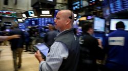 FILE PHOTO: Traders work on the floor of the New York Stock Exchange (NYSE) in New York, U.S., July 6, 2018. REUTERS/Brendan McDermid