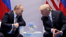 FILE PHOTO: Russia's President Vladimir Putin talks to U.S. President Donald Trump during their bilateral meeting at the G20 summit in Hamburg, Germany, July 7, 2017. REUTERS/Carlos Barria//File Photo