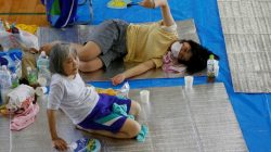 Local residents take rest at Okada elementary school acting as an evacuation center in Mabi town in Kurashiki, Okayama Prefecture, Japan, July 10, 2018. REUTERS/Issei Kato