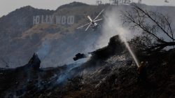 Firefighters work on a fire near the landmark Griffith Observatory in the hills overlooking Los Angeles, California, U.S. July 10, 2018. REUTERS/Patrick T. Fallon