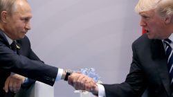 FILE PHOTO: FILE PHOTO: U.S. President Donald Trump shakes hands with Russian President Vladimir Putin during the their bilateral meeting at the G20 summit in Hamburg, Germany, July 7, 2017. REUTERS/Carlos Barria/File Photo/File Photo