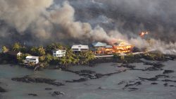 FILE PHOTO: Lava destroys homes in the Kapoho area, east of Pahoa, during ongoing eruptions of the Kilauea Volcano in Hawaii, U.S., June 5, 2018. REUTERS/Terray Sylvester/File Photo