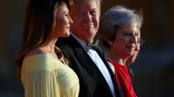 British Prime Minster Theresa May and her husband Philip stand together with U.S. President Donald Trump and First Lady Melania Trump at the entrance to Blenheim Palace, where they are attending a dinner with specially invited guests and business leaders, near Oxford, Britain, July 12, 2018. REUTERS/Hannah McKay