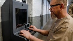 Inmate Steven Goff connects his JPay tablet device to a kiosk inside the East Jersey State Prison in Rahway, New Jersey, U.S., July 12, 2018. REUTERS/Brendan McDermid