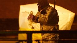 FILE PHOTO: Members of the emergency services wearing protective clothing work near the bench where former Russian intelligence officer Sergei Skripal and his daughter Yulia were found poisoned in Salisbury, Britain, March 13, 2018. REUTERS/Henry Nicholls/File Photo