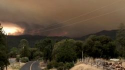 Flames and smoke rise from a treeline in Mariposa County, California, U.S., July 17, 2018 in this still image taken from a social media video obtained July 18, 2018. INSTAGRAM/@JSTETTS/via REUTERS
