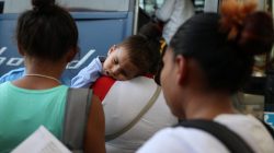 Undocumented immigrants recently released from detention prepare to depart a bus depot for cities around the country in McAllen, Texas, U.S., July 18, 2018. Picture taken July 18, 2018. REUTERS/Loren Elli