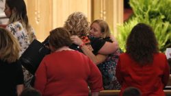 July 22, 2018; Springfield, MO, USA; Family of victims of the duck boat accident on Table Rock Lake embrace after a community wide memorial service for the families, friends and victims at College of the Ozarks in Point Lookout, Missouri on Sunday, July 22, 2018. Nathan Papes/News-Leader via USA TODAY NETWORK