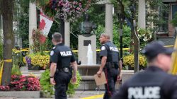 Police officers walk past Alexander the Great Parkette while investigating a mass shooting on Danforth Avenue in Toronto, Canada, July 23, 2018. REUTERS/Chris Helgren