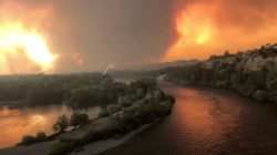 Smoke and flames are seen as a wildfire spreads through Redding, California, the U.S., July 26, 2018, in this still image taken from a video obtained from social media. Cody Markhart/via REUTERS